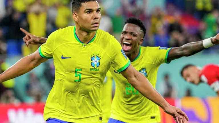 two Brazil World Cup players celebrating